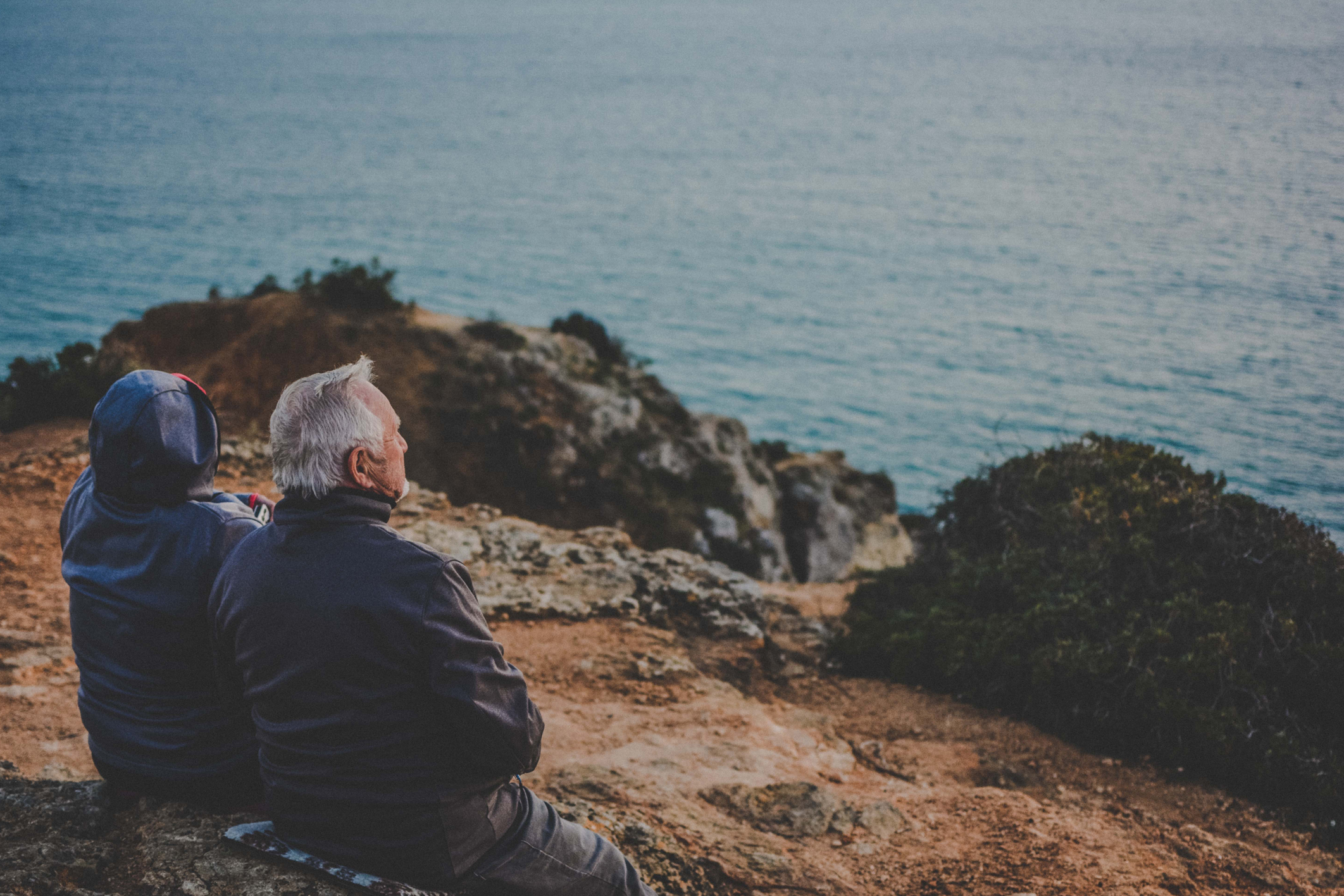 Couple facing the sea